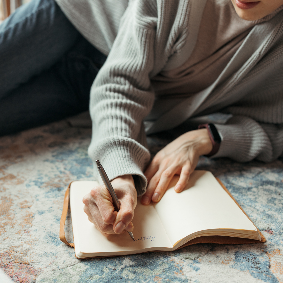 Woman writing in her journal - Tru Blue Boutique