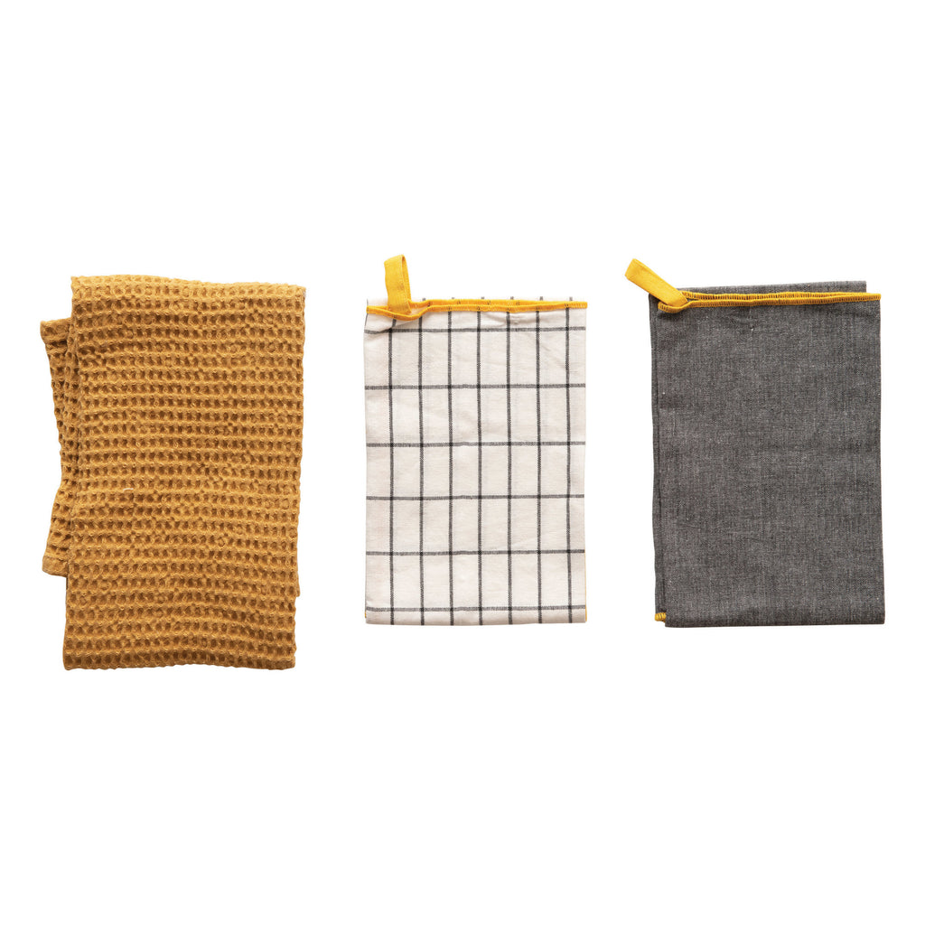 Set of 3 tea towels in charcoal, white box plaid, and gold waffle weave at Tru Blue Boutique