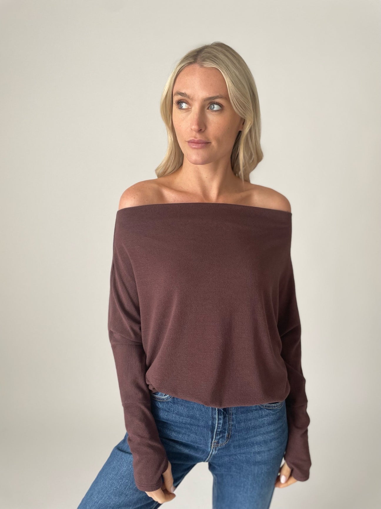 Raglan sleeve top can be worn one-shoulder in crepe hacci by Six Fifty at Tru Blue Boutique