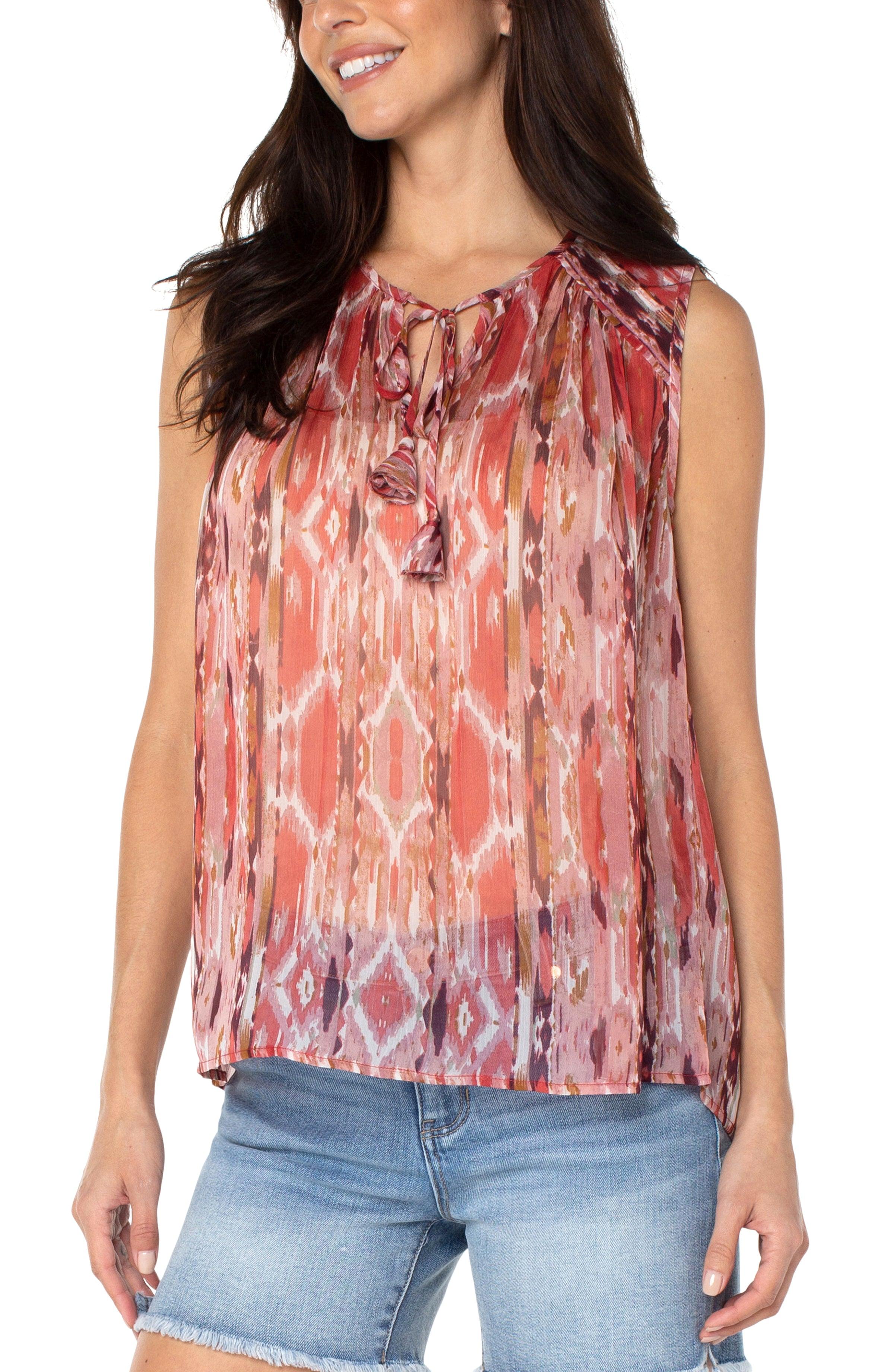  lightweight ikat print to go with the desert blossom collection. This sleeveless top has front tie and shirring with details at the shoulder.  Liverpool