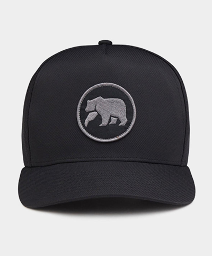 Trucker hat with circle patch performance cap by the Normal Brand - Tru Blue
