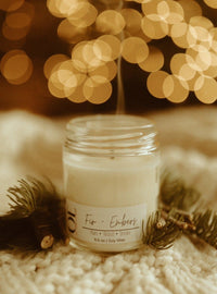 Clean burning soy wax candle in  Fir and Embers scents containing Plum, Wood, and Spice in 6.5 oz glass jar.